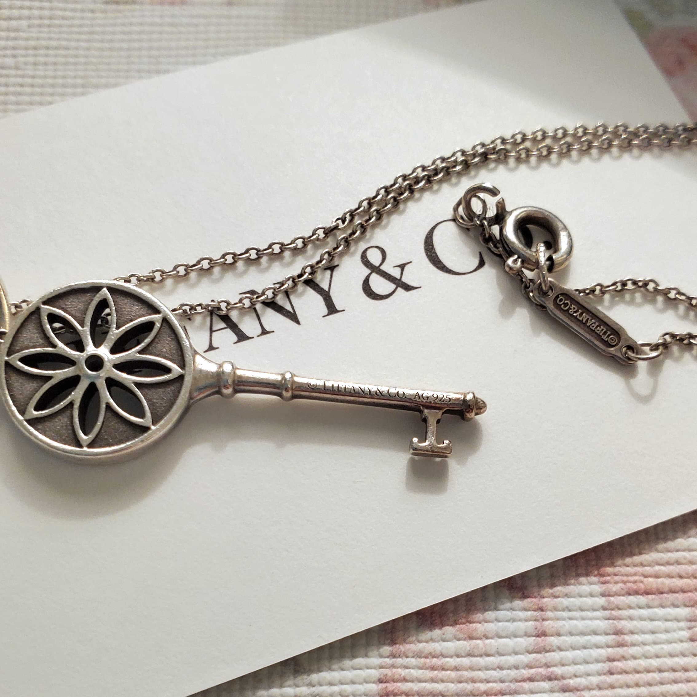 Authentic Tiffany & Co. Daisy Diamond Key Pendant and Sterling