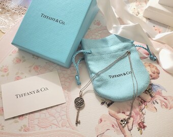 Authentic Tiffany & Co. Daisy Diamond Key Pendant and Sterling