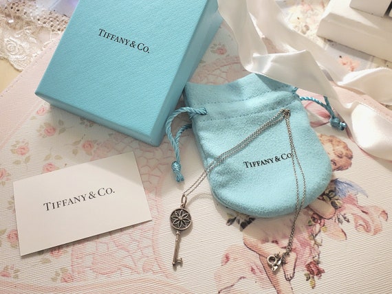 Authentic Tiffany & Co. Daisy Diamond Key Pendant and Sterling