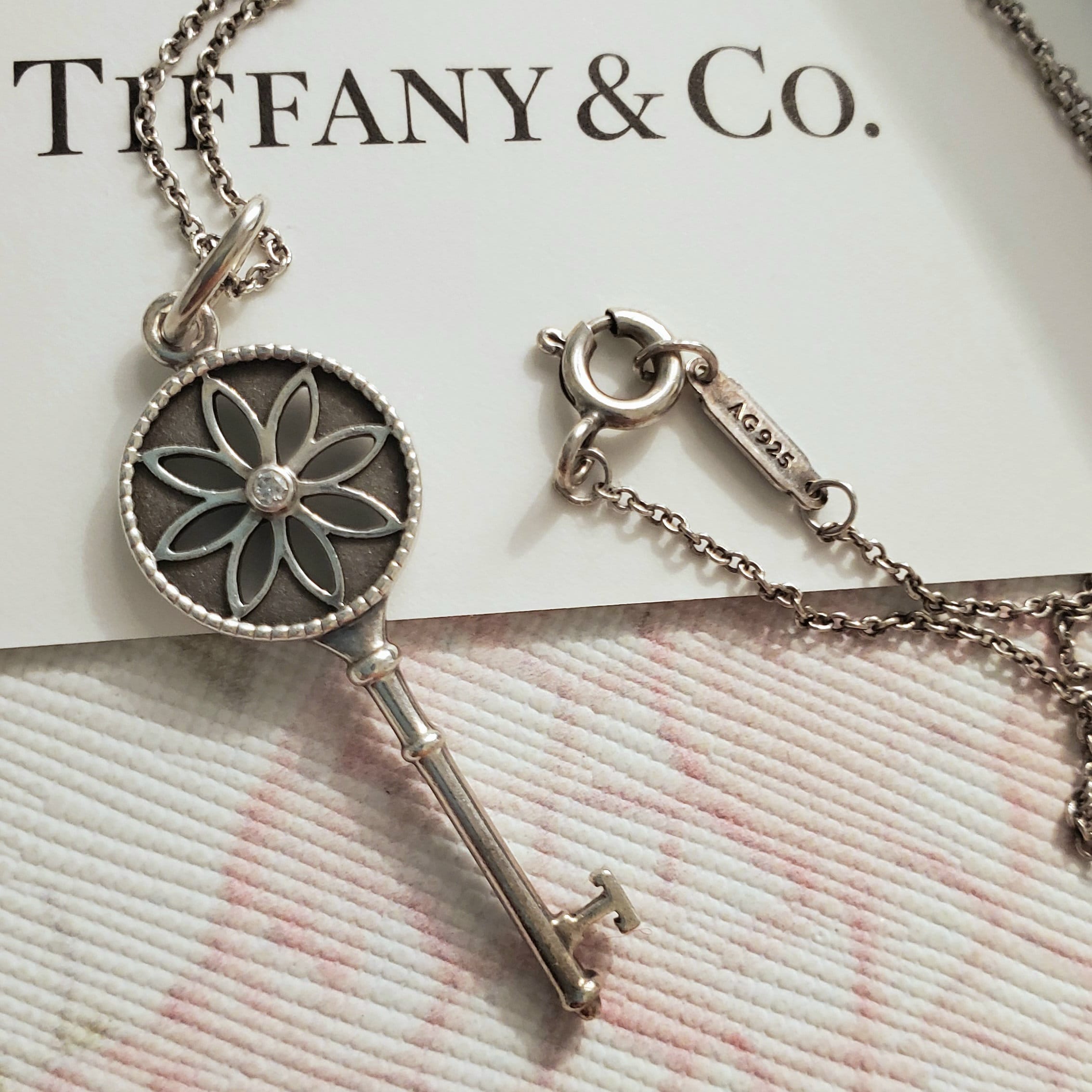 Authentic Tiffany & Co. Daisy Diamond Key Pendant and Sterling