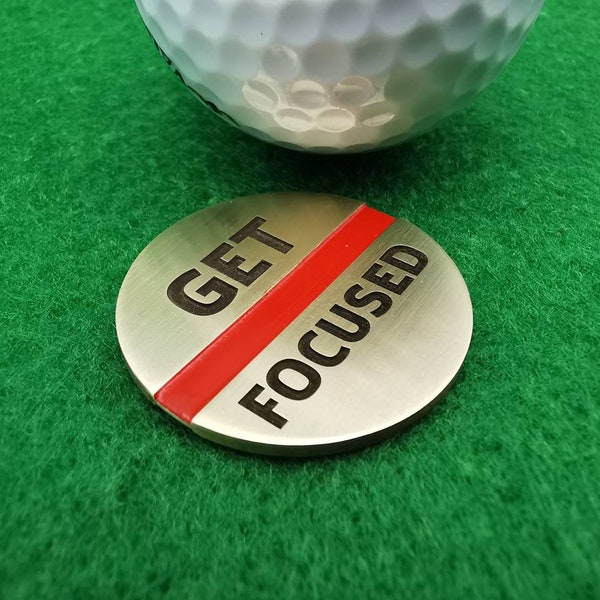 Get Focused - Golf Ballmarker. As a golf accessory for better concentration when golfing.