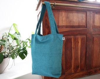 Shopper made of wide corduroy petrol with orange lining