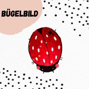 Peut inclure: Une coccinelle rouge avec des points blancs sur un fond blanc avec des pois noirs. Le texte "BÜGELBILD" est dans le coin supérieur gauche.