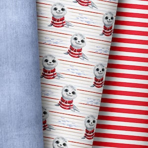 Könnte beinhalten: Ein Stoffdesign mit Cartoon-Robben, die rot-weiß gestreifte Hemden tragen. Die Robben befinden sich auf einem weißen Hintergrund mit horizontalen Streifen und kleinen blauen Fischen. Ein rot-weiß gestreifter Stoff wird ebenfalls gezeigt.