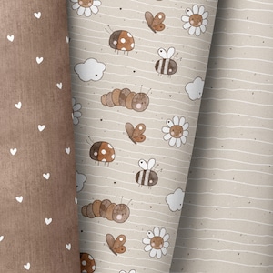 May include: A seamless pattern featuring a variety of cute woodland creatures, including ladybirds, bees, butterflies, and caterpillars. The pattern is set on a light brown background with white accents and is perfect for fabric, wallpaper, or wrapping paper.