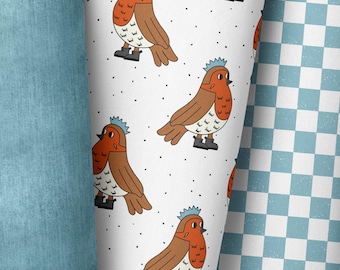 May include: A white background with a repeating pattern of red robins wearing blue crowns. The robins are cartoon-style and have black eyes and beaks. The background is dotted with small black dots.