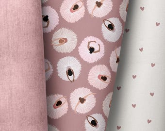 May include: A pink fabric with a repeating pattern of ballerinas in white tutus. The ballerinas are all facing the same direction and have dark skin. The fabric is a soft, textured material.