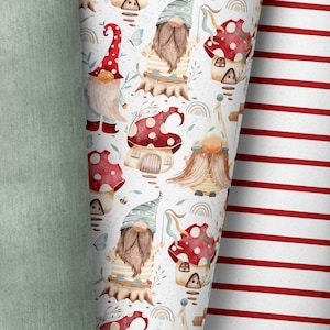 May include: A roll of patterned fabric featuring whimsical gnomes, mushrooms, and rainbows on a white background. The gnomes wear hats and striped shirts. A second roll displays red and white stripes. A third roll is a solid light green.