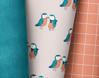 May include: A seamless pattern featuring a pair of blue and pink birds kissing on a light pink background.