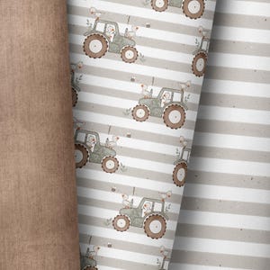 May include: A seamless pattern featuring a green tractor with brown wheels and white ducks on a light gray and white striped background.