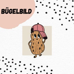 Puede incluir: Un personaje de dibujos animados con forma de cacahuete que lleva una gorra de béisbol rosa, con el texto alemán "BÜGELBILD" encima. El cacahuete es marrón con manchas negras y está sobre un fondo blanco texturizado.