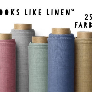 Könnte beinhalten: Nahaufnahme von sechs Stoffrollen in verschiedenen Farben, darunter rosa, grau, grün, blau und braun. Der Stoff hat eine Leinen-ähnliche Textur. Der Text "LOOKS LIKE LINEN" und "25 FARBEN" ist über den Rollen sichtbar.