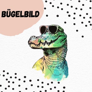 May include: A green and blue alligator wearing sunglasses. The alligator has a watercolor effect and is looking to the right. The background is white with black polka dots.