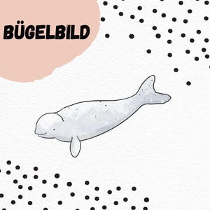 May include: A white beluga whale with a black outline, swimming in a white background with black polka dots. The text "BÜGELBILD" is in the top left corner of the image.