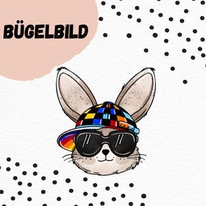 May include: A cartoon illustration of a rabbit wearing sunglasses and a colorful checkered hat with a rainbow brim. The image includes the German text "BÜGELBILD" in bold, black letters, set against a white background with black polka dots.