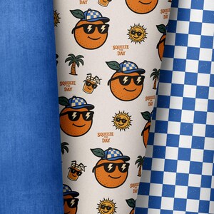 May include: A collection of fabrics featuring playful summer designs. One fabric has a repeating pattern of smiling oranges wearing sunglasses and hats, palm trees, and the text "Squeeze the Day." Other fabrics include solid blue and a blue and white checkered pattern.