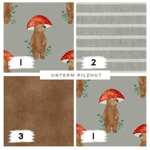 May include: A collage of fabric swatches. One swatch features a repeating pattern of a brown bear under a red mushroom, another has gray and white stripes, and the third is a solid brown. The text "UNTERM PILZHUT" is in the center.