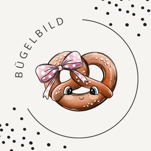 May include: A brown pretzel illustration with a pink polka dot bow, large eyes, and a small smile. The text BÜGELBILD is printed in black capital letters along the left side of the circular frame, which is accented by scattered black dots.