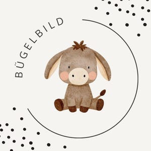 May include: A watercolor illustration of a seated donkey with a light brown body, large ears, and a small tail. The donkey has pink cheeks and is surrounded by a black circle and the word "BÜGELBILD". Black dots are scattered around the circle.