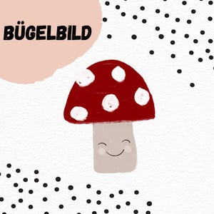 May include: A whimsical illustration of a red mushroom with white spots and a smiling face. The image includes the German text "BÜGELBILD" in black letters, set against a white background with black polka dots. The mushroom has a beige stem.