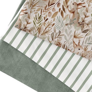 Könnte beinhalten: Drei Stoffmuster in verschiedenen Mustern. Das obere Muster zeigt einen weißen Hintergrund mit einem Aquarellmuster aus braunen und grünen Blättern, Zweigen und kleinen Tieren. Das mittlere Muster ist weiß mit grünen Streifen. Das untere Muster ist einfarbig grün.