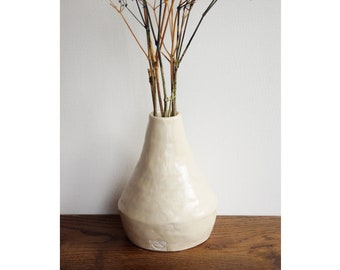 Small beige ceramic vase