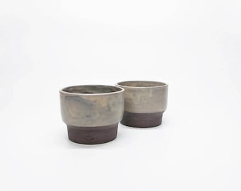 A set of two wheelthrown basalt gray-brown ceramic cups