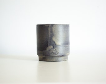 Small gray ceramic cup