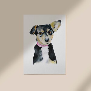 May include: Watercolor painting of a black and brown dog with a pink collar, looking directly at the viewer.