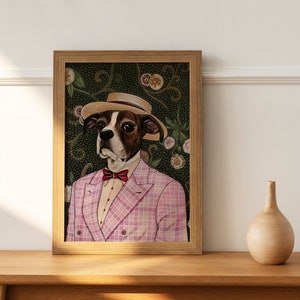 May include: A framed illustration of a dog wearing a pink plaid suit, a bow tie, and a straw hat. The dog is set against a green background with floral patterns.