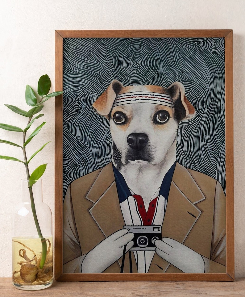 May include: A framed illustration of a dog wearing a brown suit and a white headband with red stripes. The dog is holding a vintage camera in front of its chest. The background is a blue and white abstract pattern.