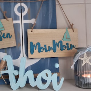 Napis dekoracyjny &quot;Moin Moin&quot; wykonany z drewna
