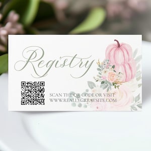 May include: A white card with the word "Registry" in elegant script, a QR code, and the text "SCAN THE QR CODE OR VISIT WWW.REALLYGREATSITE.COM". The card features a watercolor illustration of two pink pumpkins and floral accents.