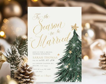 May include: A white invitation card with gold glitter text that reads "Tis the Season to be Married". The card features a green Christmas tree with gold stars and snowflakes. The text also includes the bride's name, date, time, and location for a bridal shower.