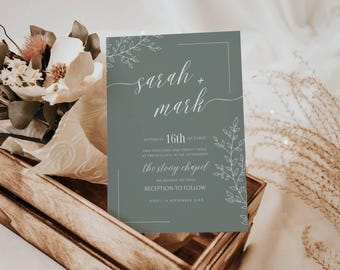 May include: A sage green wedding invitation with white calligraphy that reads "sarah + mark" and details for the wedding ceremony and reception. The invitation features a simple floral design.