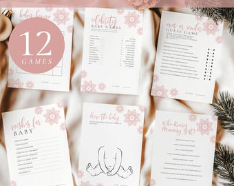 May include: A set of six white baby shower game cards featuring pink snowflake accents and black text. The cards include Baby Bingo, Celebrity Baby Names, Over or Under Guess Game, Wishes for Baby, Draw the Baby, and Who Knows Mommy Best, with 8.5x11 and 5x7 inch sizes.