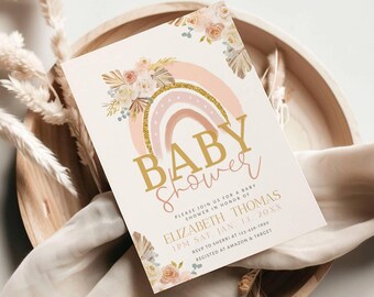 May include: A pink and gold baby shower invitation with a rainbow and floral design. The text reads "BABY SHOWER" and includes the name "ELIZABETH THOMAS" and the date "SAT, JAN. 13, 20XX".