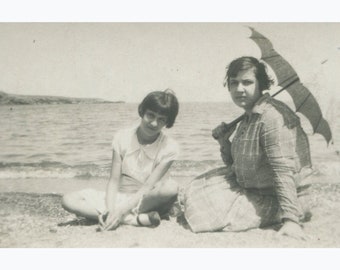 Mother (summer umbrella) with her daughter on the beach. Greece 1930s.  Vintage photo. [51601]