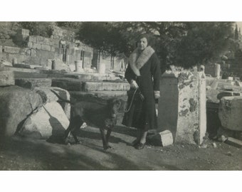 Lady with her dog.Probably in Ancient Market of Athens. Greece 1930s. Vintage photo. [50081]