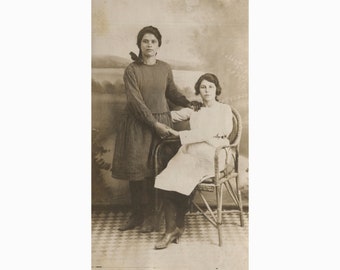 Two young ladies, friends - background. Greece 1920s. Photo Postcard size [53035]