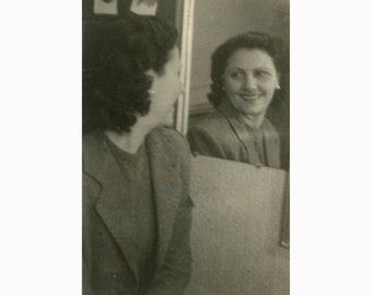 Woman in front of a mirror. Greece 1950s Vintage photo. [52472]