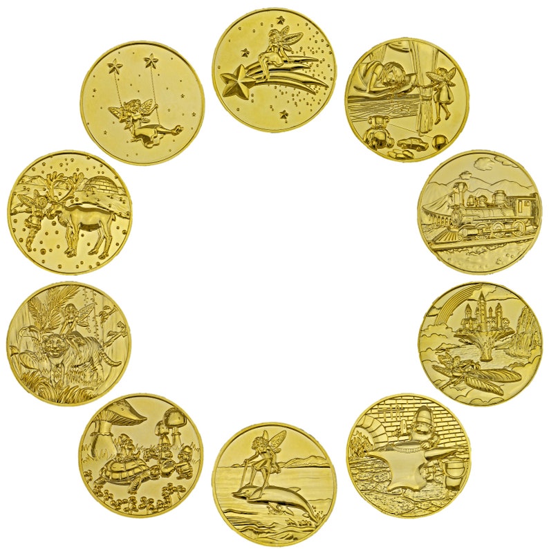 May include: Twelve gold-colored round tokens with various images, including fairies, a train, a castle, and a mushroom. The tokens are arranged in a circle on a white background.