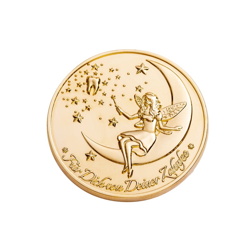 May include: A gold-colored coin with a fairy sitting on a crescent moon. The fairy is holding a wand and there are stars in the background. The text "F&uuml;r Dich von Deiner Zahnfee" is inscribed around the edge of the coin.