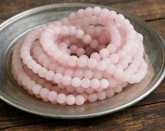 Light frosted rose quartz bead strand, round, 4 - 4.3 mm (approx. 100 beads / approx. 39 cm length)