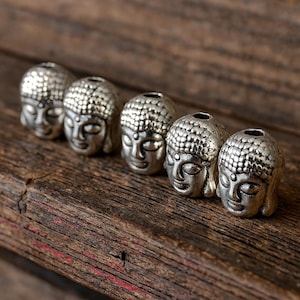 5 Buddha Perlen aus Metall antik silberfarben 9 x 7 x 7 mm