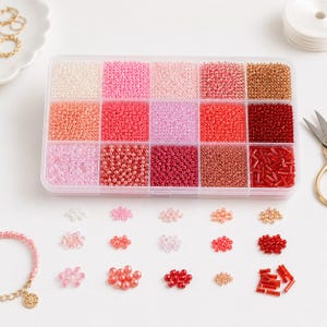 Caja de cuentas con cuentas de vidrio pequeñas - mezcla de colores rosa