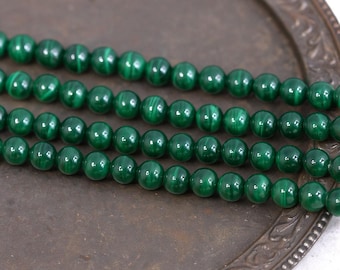 Malachite bead strand, 6 - 6.3 mm round beads (approx. 65 beads / approx. 40 cm length)