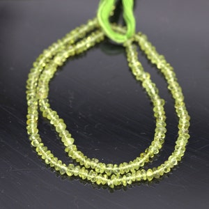 Peridot Edelstein Perlenstrang 3,7 - 3,8 x 2,2 - 2,4 mm unregelmäßige Rondelle (ca. 35 cm Länge)