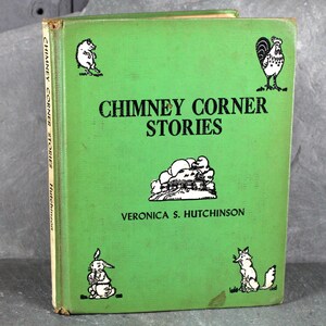 May include: A green hardback book titled "Chimney Corner Stories" by Veronica S. Hutchinson. The cover features black and white illustrations of a rooster, a pig, a rabbit, and a fox.
