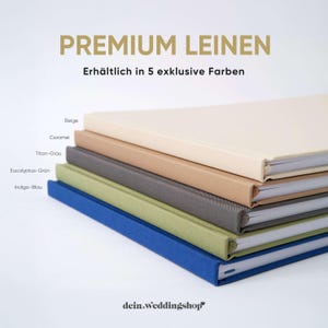 May include: A stack of five linen-covered notebooks in various colors: beige, caramel, gray, green, and blue. The notebooks are labeled with the text "PREMIUM LEINEN" and "Erh&auml;ltlich in 5 exklusive Farben". The brand name "dein.weddingshop" is at the bottom.
